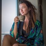 Alternative looking hippy woman in an outdoor setting wearing Alex Tooth Emerald StarGate Flow Kimono Robe.