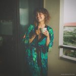 Alternative looking hippy woman in an outdoor setting wearing Alex Tooth Emerald StarGate Flow Kimono Robe.