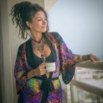 Alternative looking hippy woman in an outdoor setting wearing Alex Tooth Inner Flight Flow Kimono Robe.
