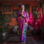 Hippy woman in yoga studio with tattoos wearing Alex Tooth Radiant Bloom MoonFlow Kimono robe.