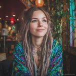 Hippy woman in boho cafe with tattoos wearing Alex Tooth Emerald StarGate MoonFlow Kimono robe.