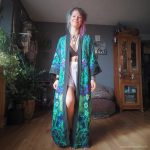 Hippy woman in yoga studio with tattoos wearing Alex Tooth Emerald StarGate MoonFlow Kimono robe.
