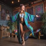 Hippy woman in yoga studio with tattoos wearing Alex Tooth Emerald StarGate MoonFlow Kimono robe.