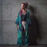 Hippy woman in yoga studio with tattoos wearing Alex Tooth Emerald StarGate MoonFlow Kimono robe.