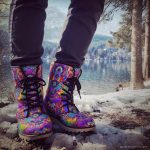 A pair of Alex Tooth Inner Flight Driftwalker boots in an outdoor winter setting.