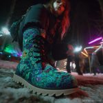 A pair of Alex Tooth Emerald StarGate Driftwalker boots in an outdoor winter setting.
