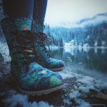 A pair of Alex Tooth Emerald StarGate Driftwalker boots in an outdoor winter setting.
