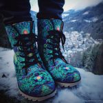 A pair of Alex Tooth Emerald StarGate Driftwalker boots in an outdoor winter setting.