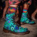 A pair of combat boots at a music festival, the boots are Alex Tooth Emerald StarGate Spirit Boots.