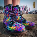 A pair of combat boots at a music festival, the boots are Alex Tooth Inner flight Spirit Boots.